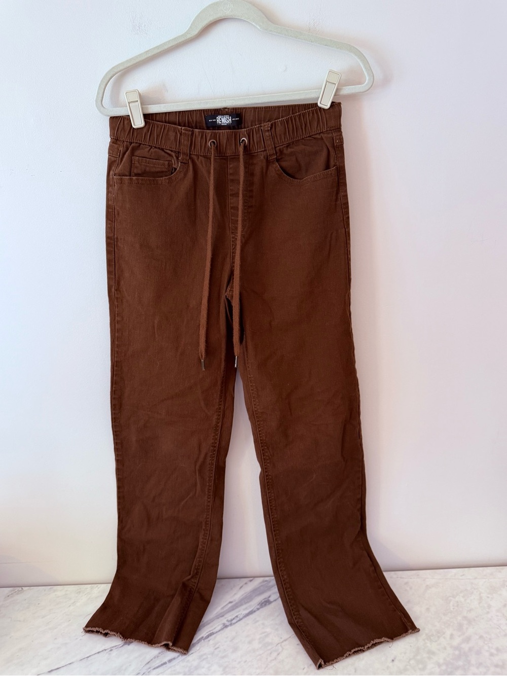 Rewash Brown denim Pants Elastic Waist Drawstring. Size small. Raw hem.